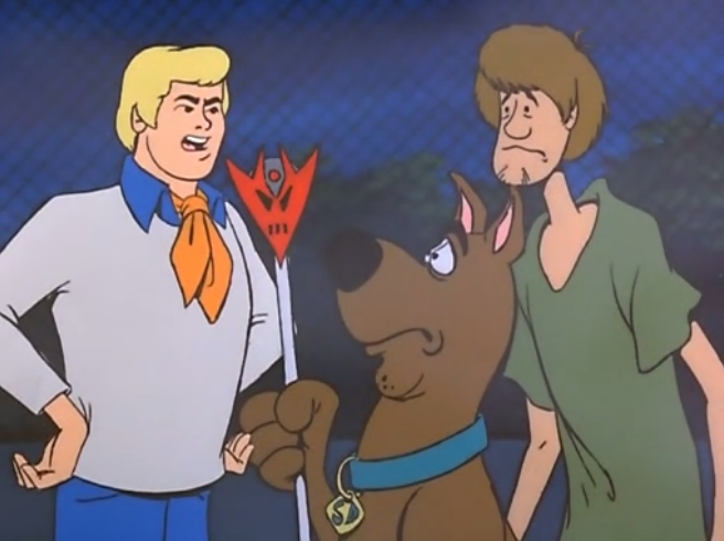  Shaggy and Scooby earn a sharp rebuke from Fred for only bringing a single staff to the staff meeting. 