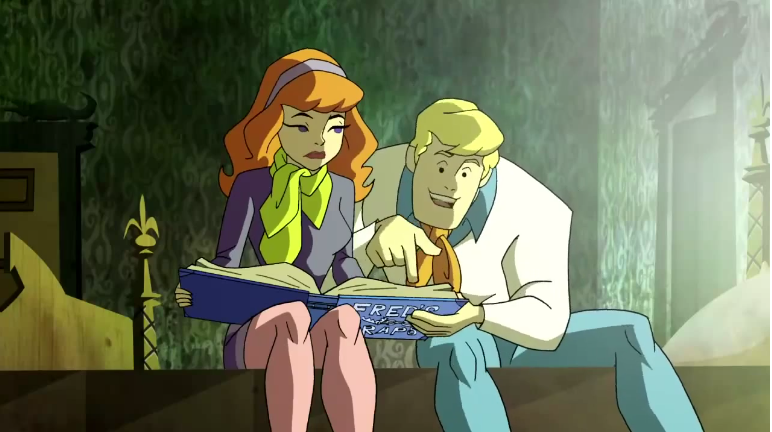  Fred lectures Daphne about the many entries in his Mansplaining Scrapbook. 