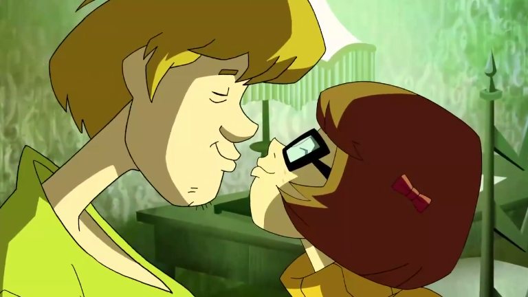  Overwhelmed by curiosity, Shaggy and Velma taste each others' chapstick. Just as friends, of course!&nbsp; 
