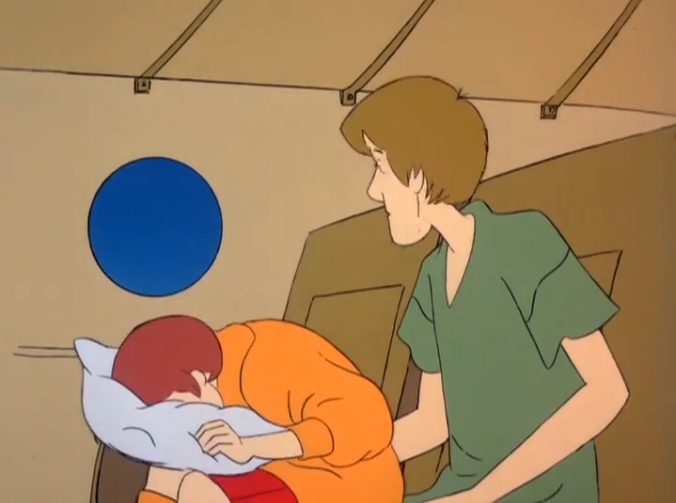  Shaggy envies the comfortable position Velma has coaxed her jetlagged body into. 