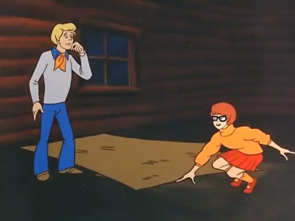  Velma tried to warn him, but it was too late- Fred had already stepped on the Throw Rug of Youth. 