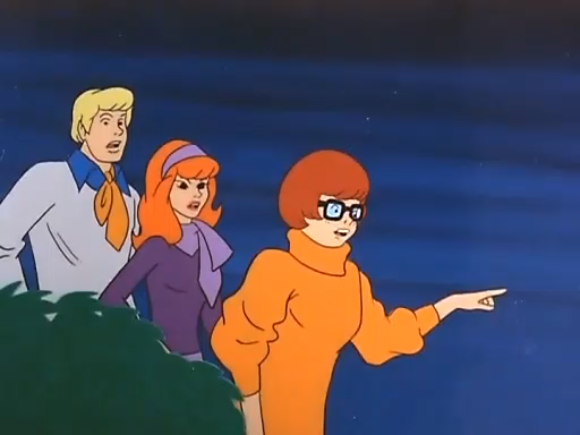  Velma points out a couple of weirdos who don’t keep their mouths open at all times.  