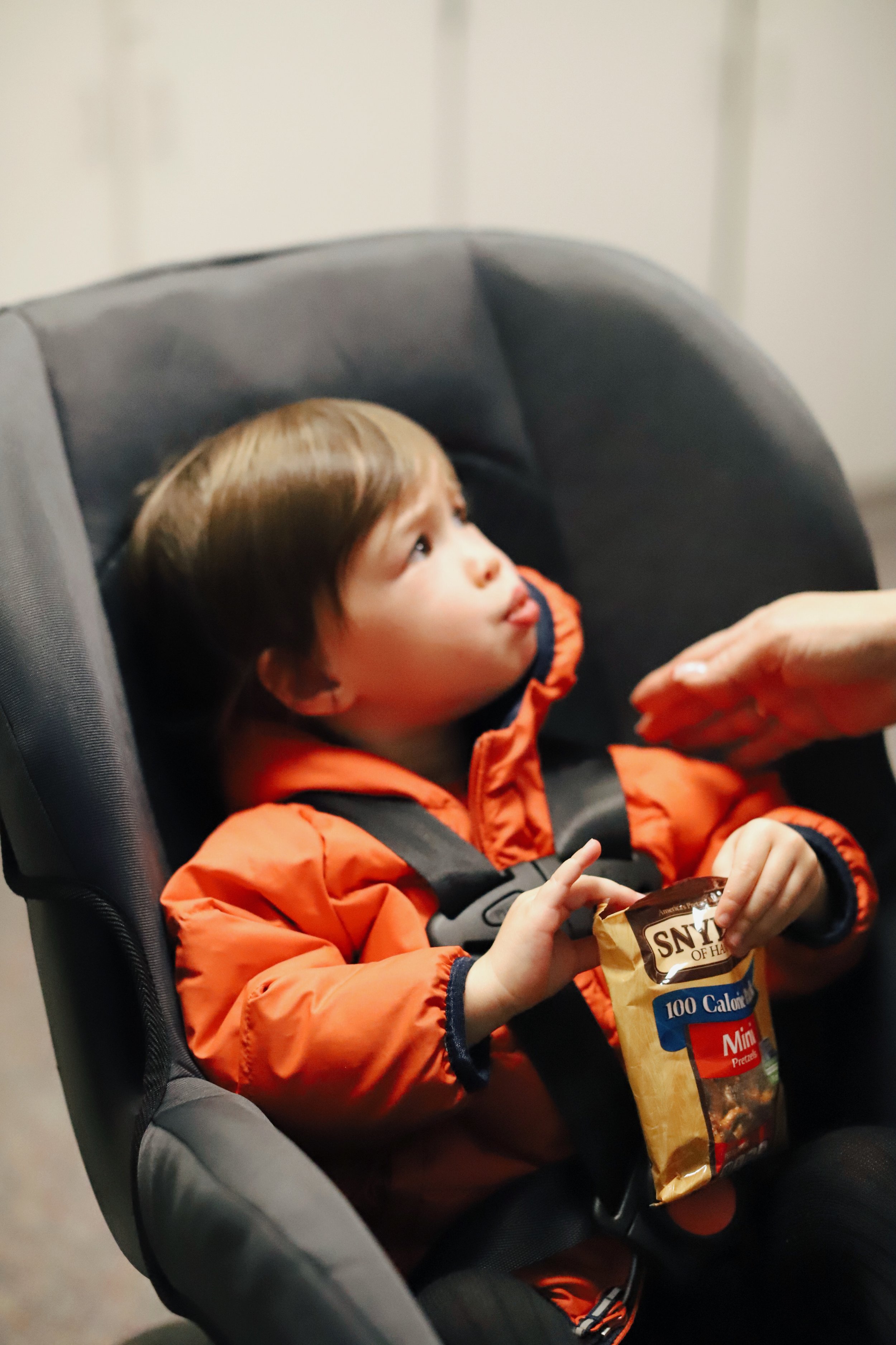 THE WRONG WAY: Do not wear puffy winter coats in a car seat.