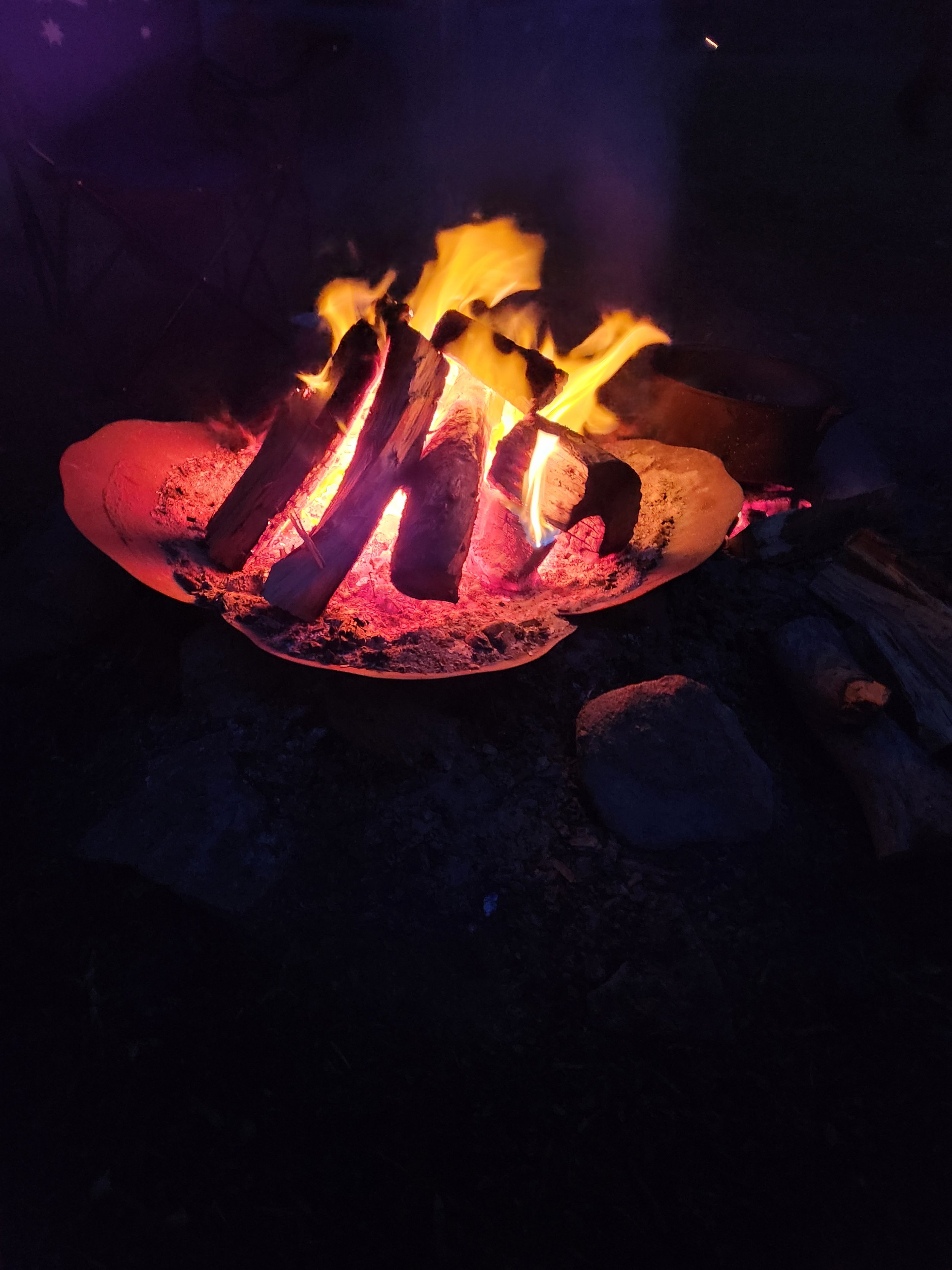 A campfire provides plenty of entertainment and jobs for kids to help with