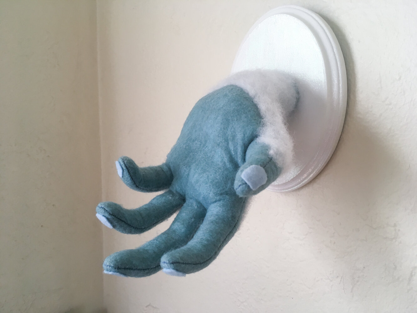  Poseable Yeti Hand. Synthetic felt, polyester fiber fill, wire, wood. 