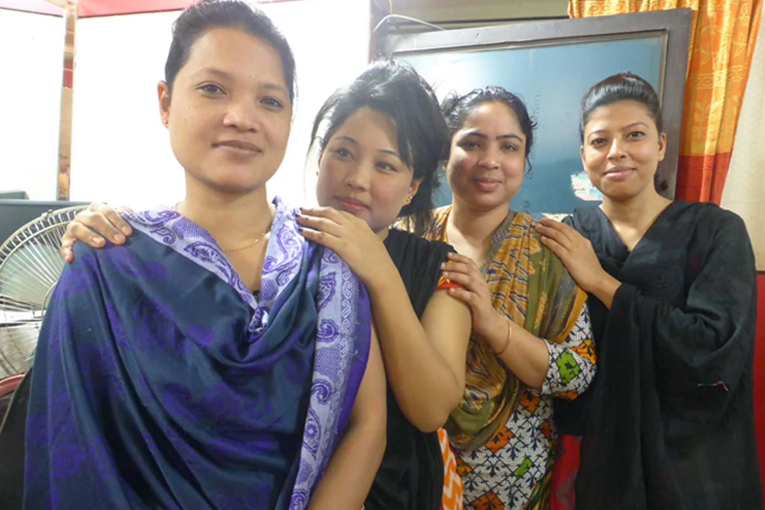 With her colleagues at her current place of employment, a parlour called Shubecca.