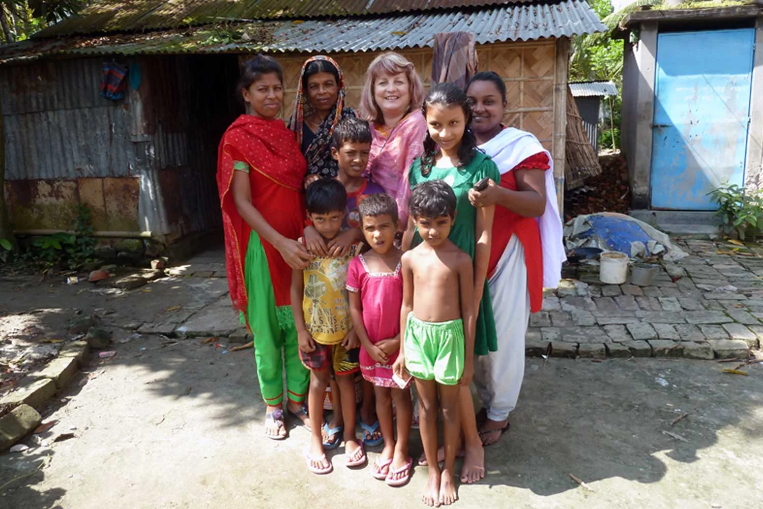Outside Sharmin’s home in Mymensingh, with her mother, daughter and friends.