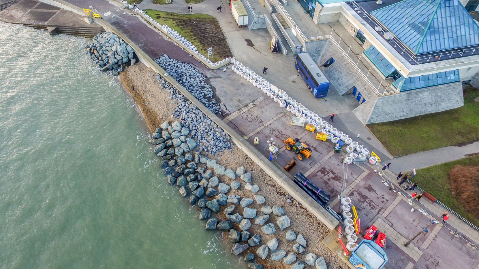 Above: rocks placed on the seafront beside The Pyramids Centre after sea defences crumbled in December 2015