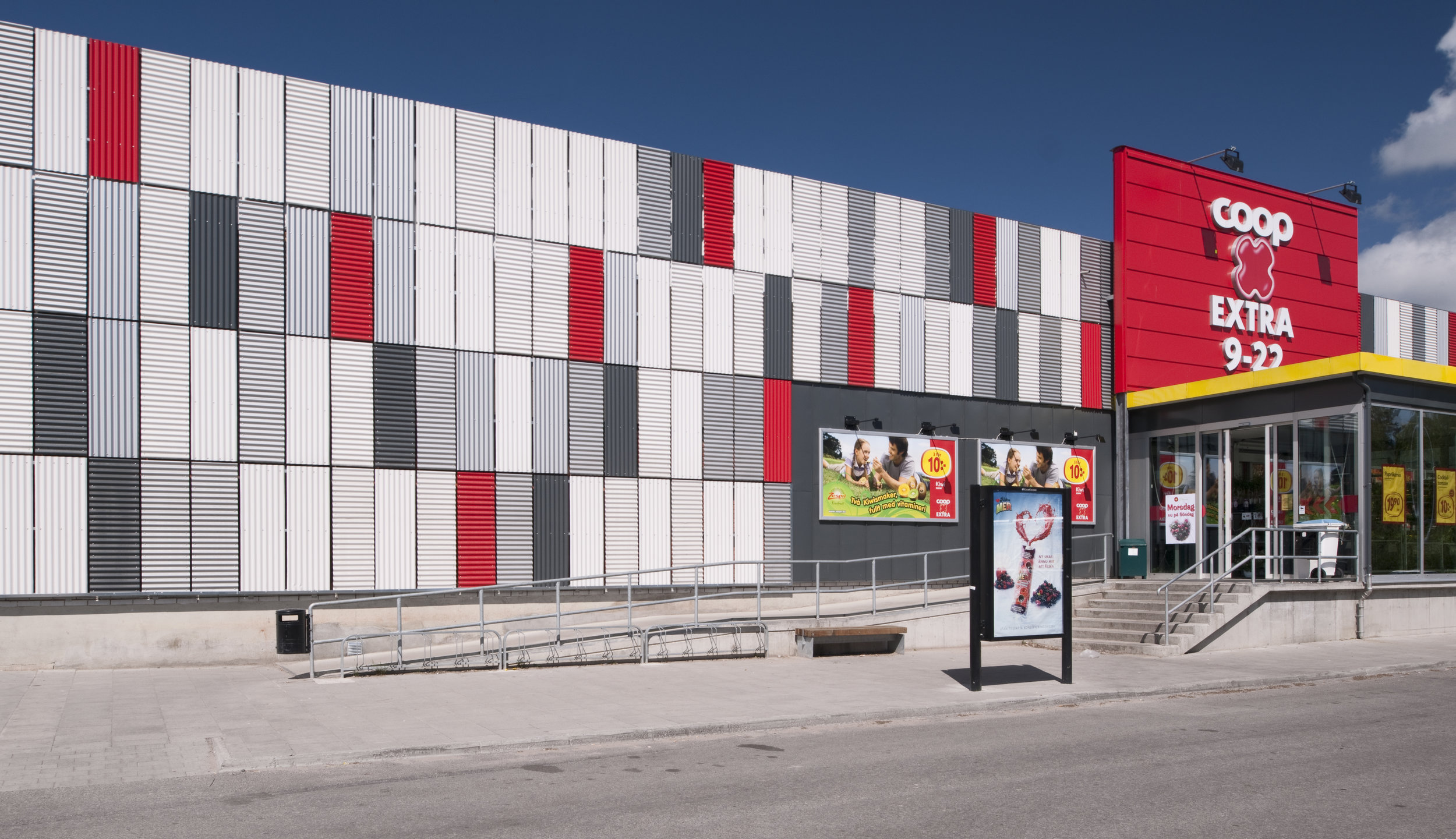 KF Fastigheter facade concept. White, silver and red facade panels that are placed randomly.