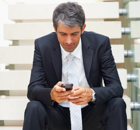 BusinessManTexting1-cr.jpg