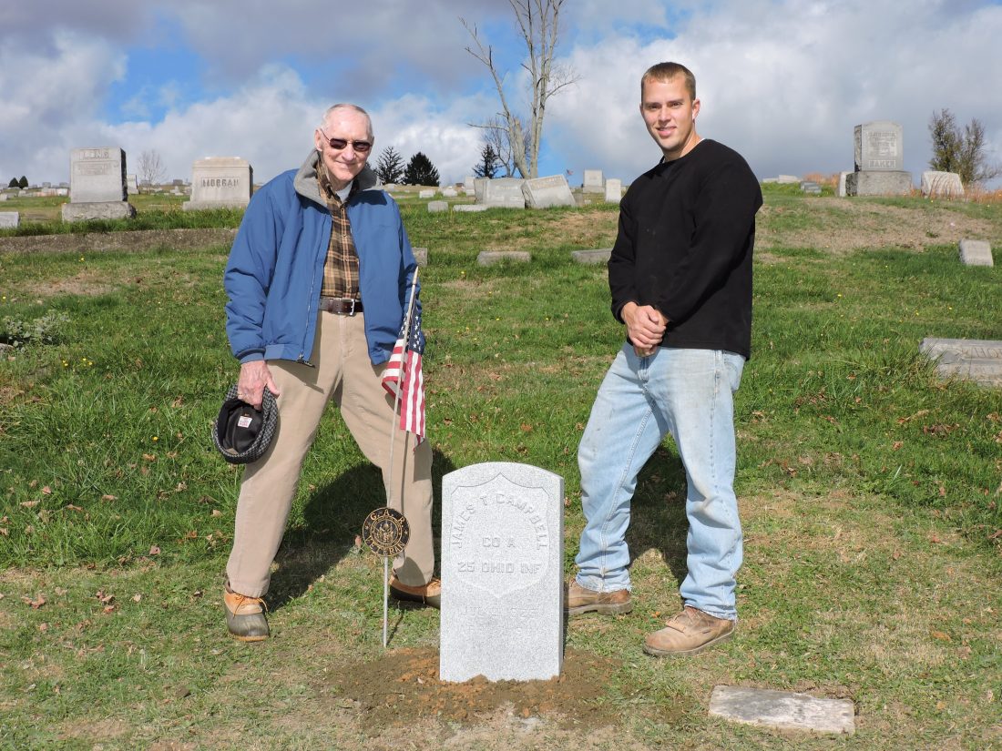 T-L Photos/SHELLEY HANSON ABOVE: GENE CAMPBELL, left, stands beside his great-great-grandfather’s new Civil War grave marker at Riverview Cemetery that was provided by the Veterans Administration and installed by Justin Gallagher of Randall L. Gallagher Memorials.