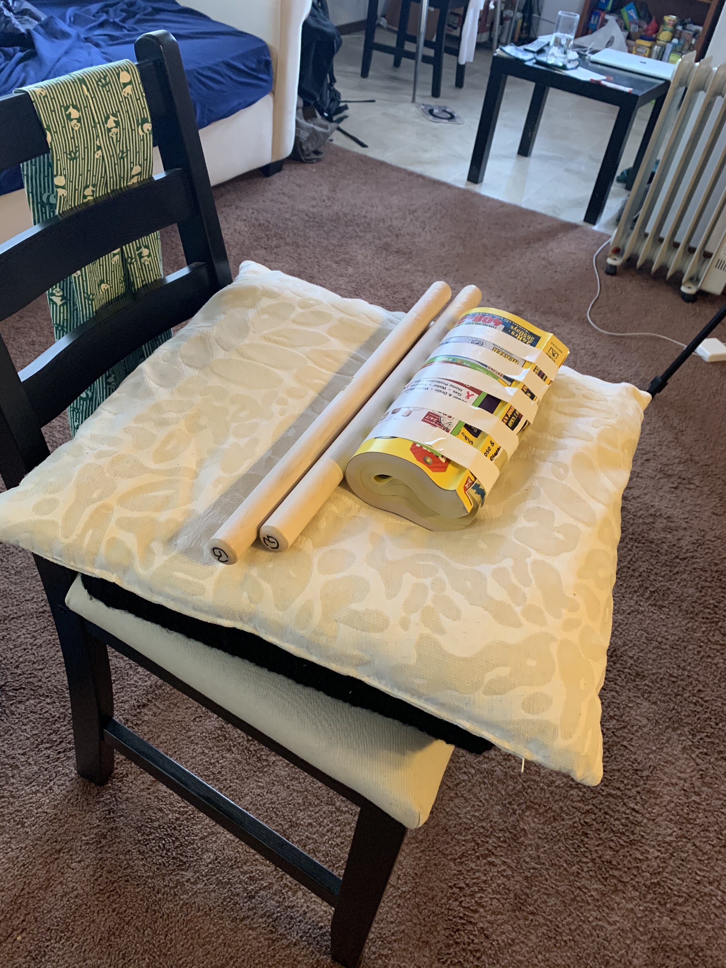  You can use a rolled up and taped phone book as a taiko.  Many taiko players have and still use this a practice tool. 