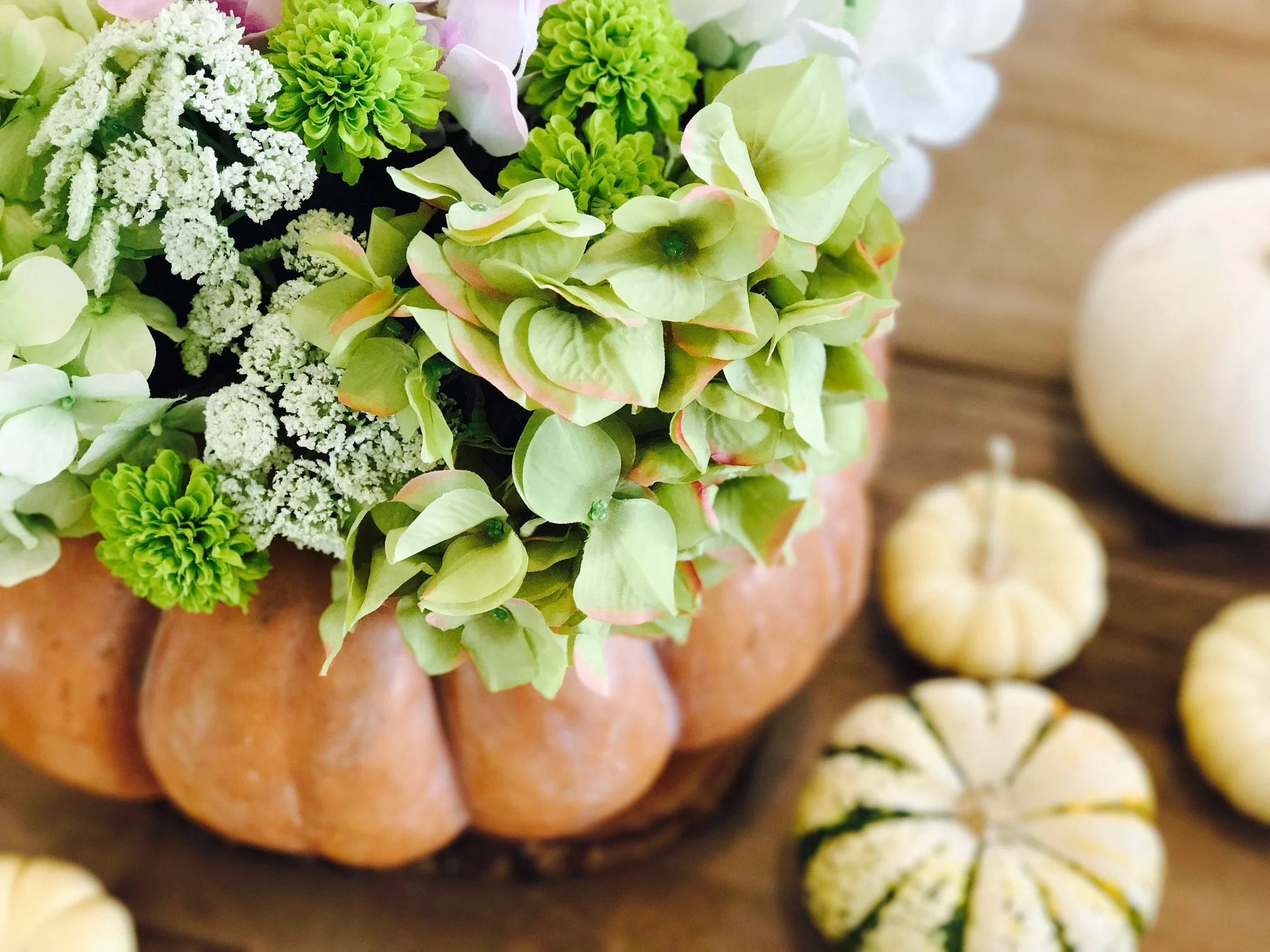 While I love freshly cut flowers, I think faux flowers work great for this project! I like to choose various green hues because they look so real!!! (Unlike the bright pinks and reds, that clearly look fake.)
