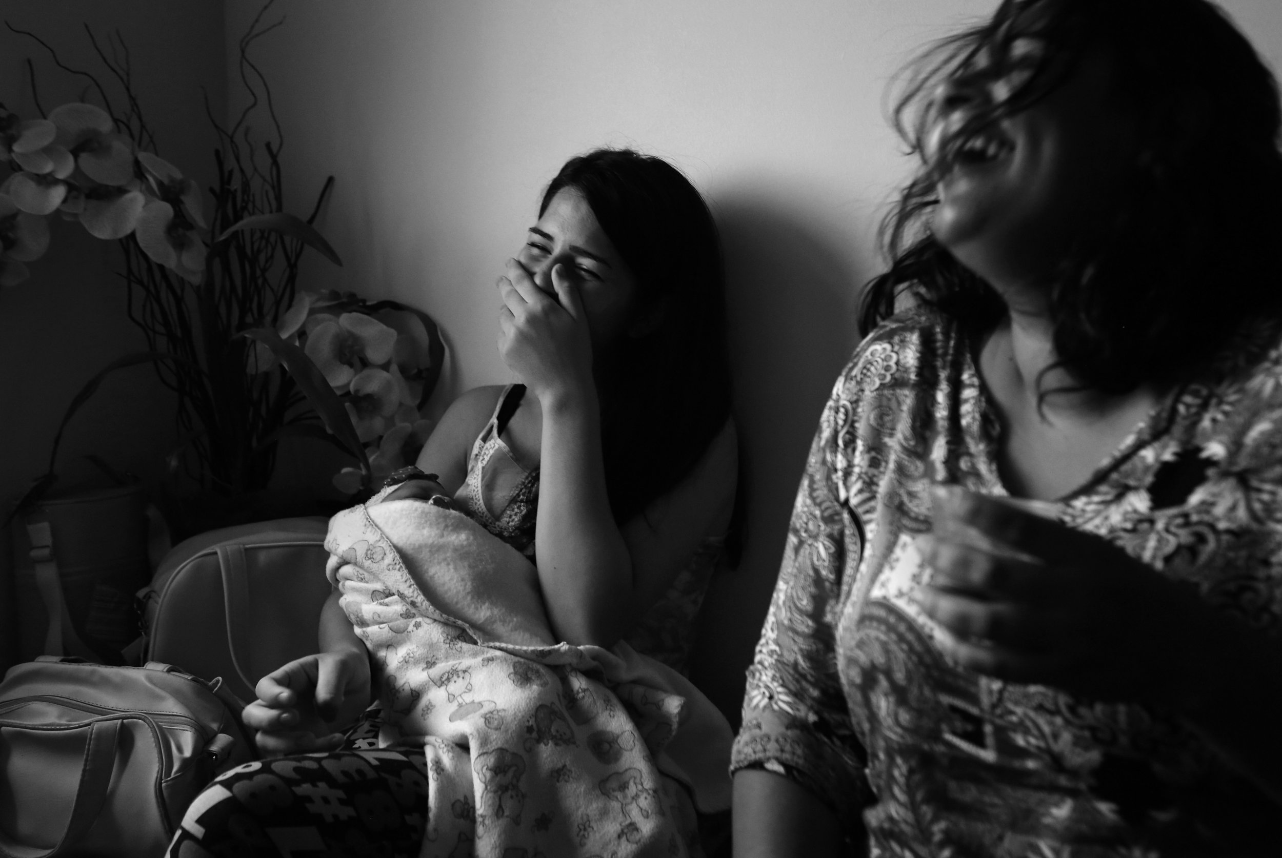  Ianka Barbosa, age 18, left, shares a laugh with Maria da Silva, as they wait for their babies’ physiotherapy appointments at the Pedro 1 Municipal Hospital. The hospital is more than a treatment center: It has become a refuge for families, a place 