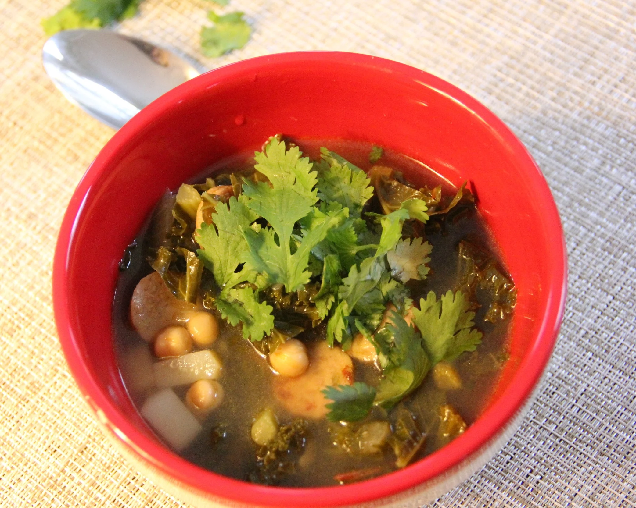 Hearty kale and sausage soup to keep you warm on a cold and snowy day