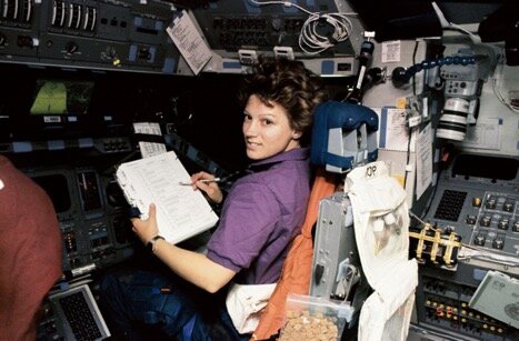 Fig. 4. Eileen M. Collins, who was the first woman to pilot the shuttle, on board Discovery in 1995. Credit: NASA.