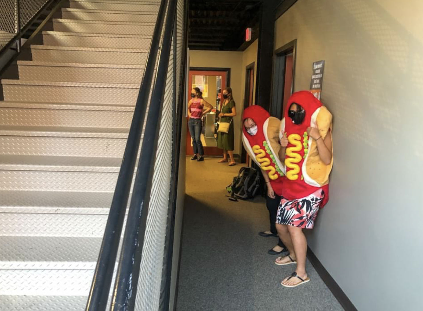 Director of Student Activities Sophie Xiong and Math Instructor Tancy Wenrich wait to surprise the student body in…well, hot dog costumes.