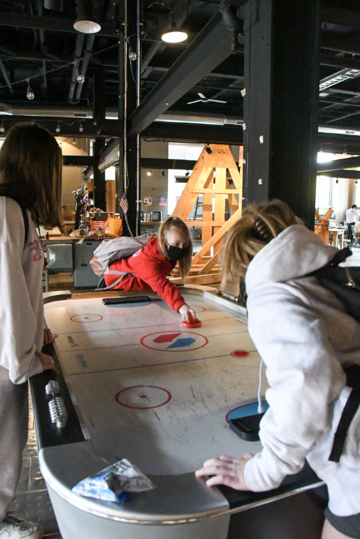 …the air hockey gets intense .