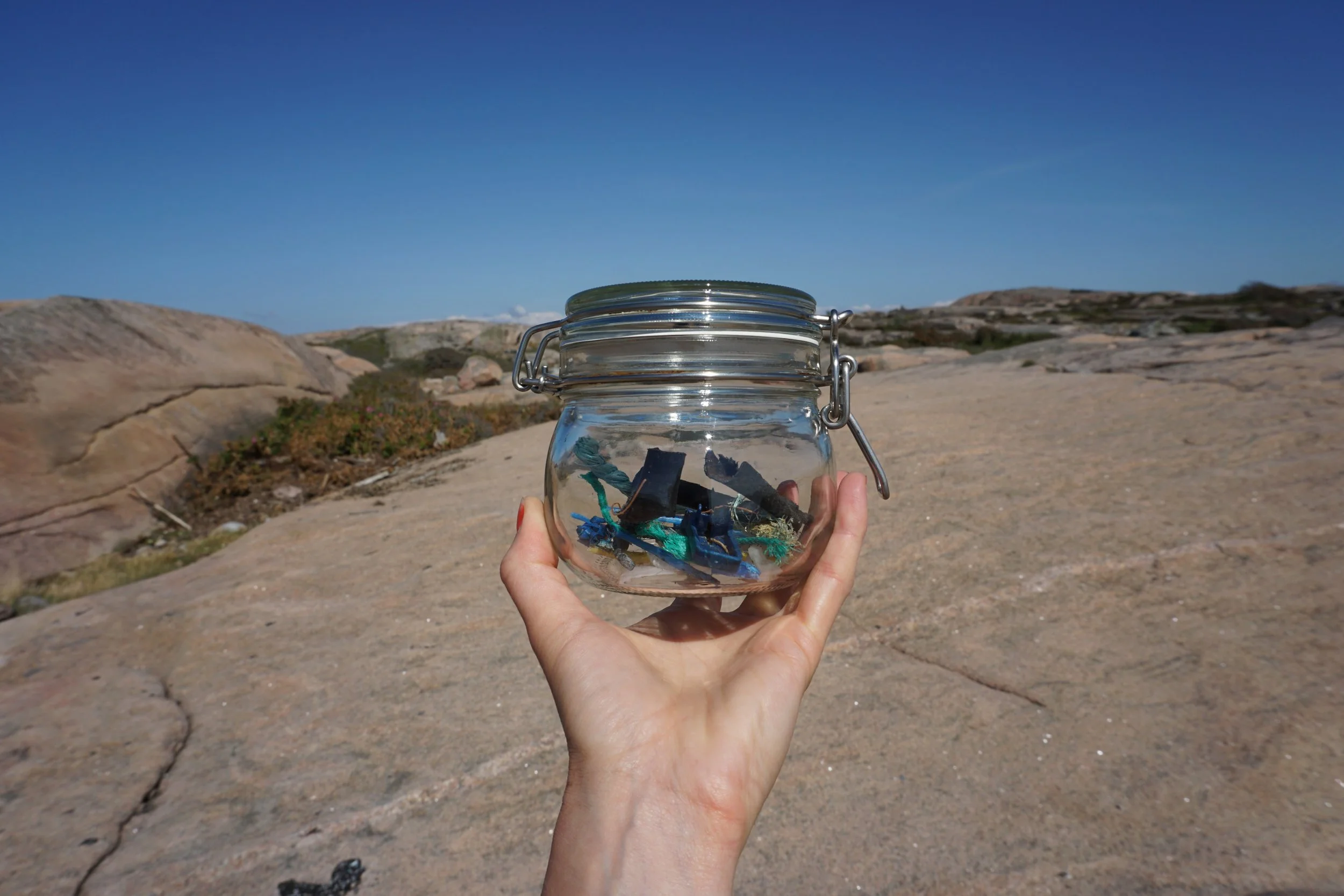 Plastic pollution collected in a jar on an island in Sweden.