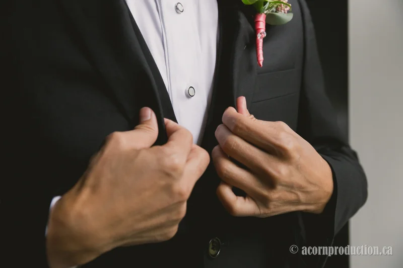 14-chinese-groom-putting-tux-on