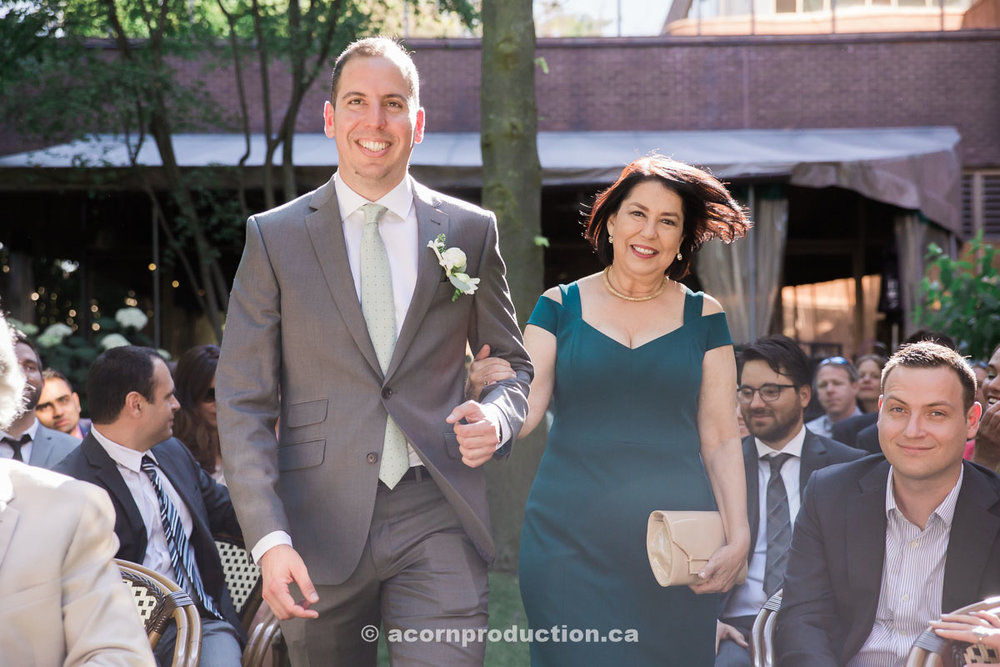 groom-walking-in-with-mom.jpg