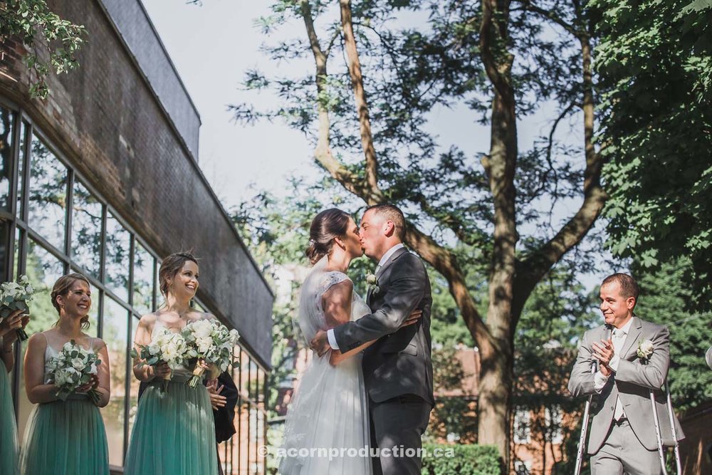 toronto-granite-brewery-wedding-cermony-bride-and-groom-kissing.jpg
