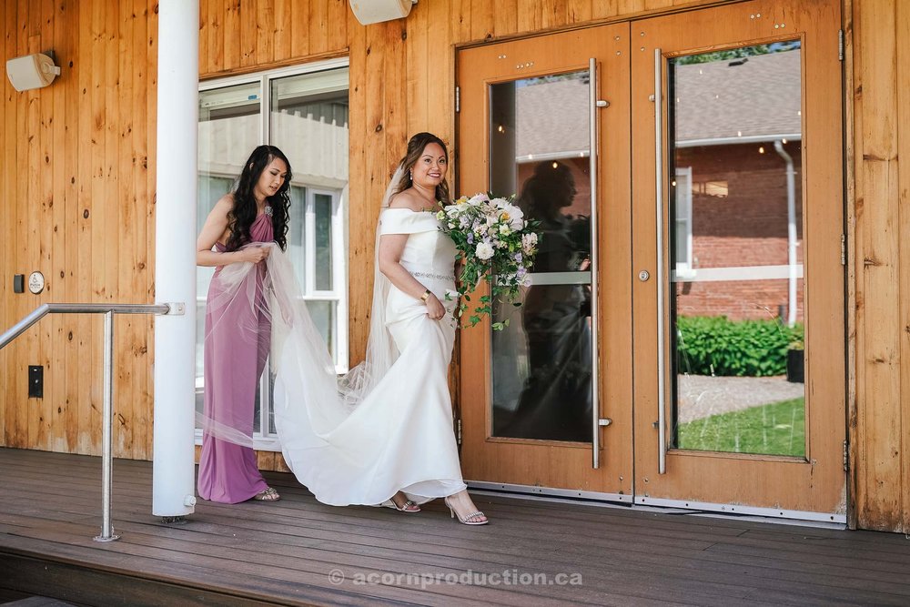 102-bride-walking-inside-stouffville-museum-porch-before-first-look.jpg