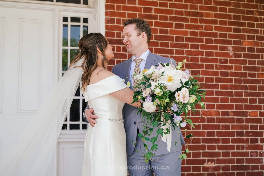 104-groom-seeing-bride-first-time-in-wedding-dress-at-stouffville-museum.jpg