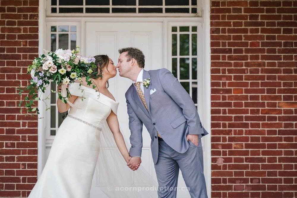 113-bride-and-groom-lean-towards-each-other-for-a-kiss.jpg