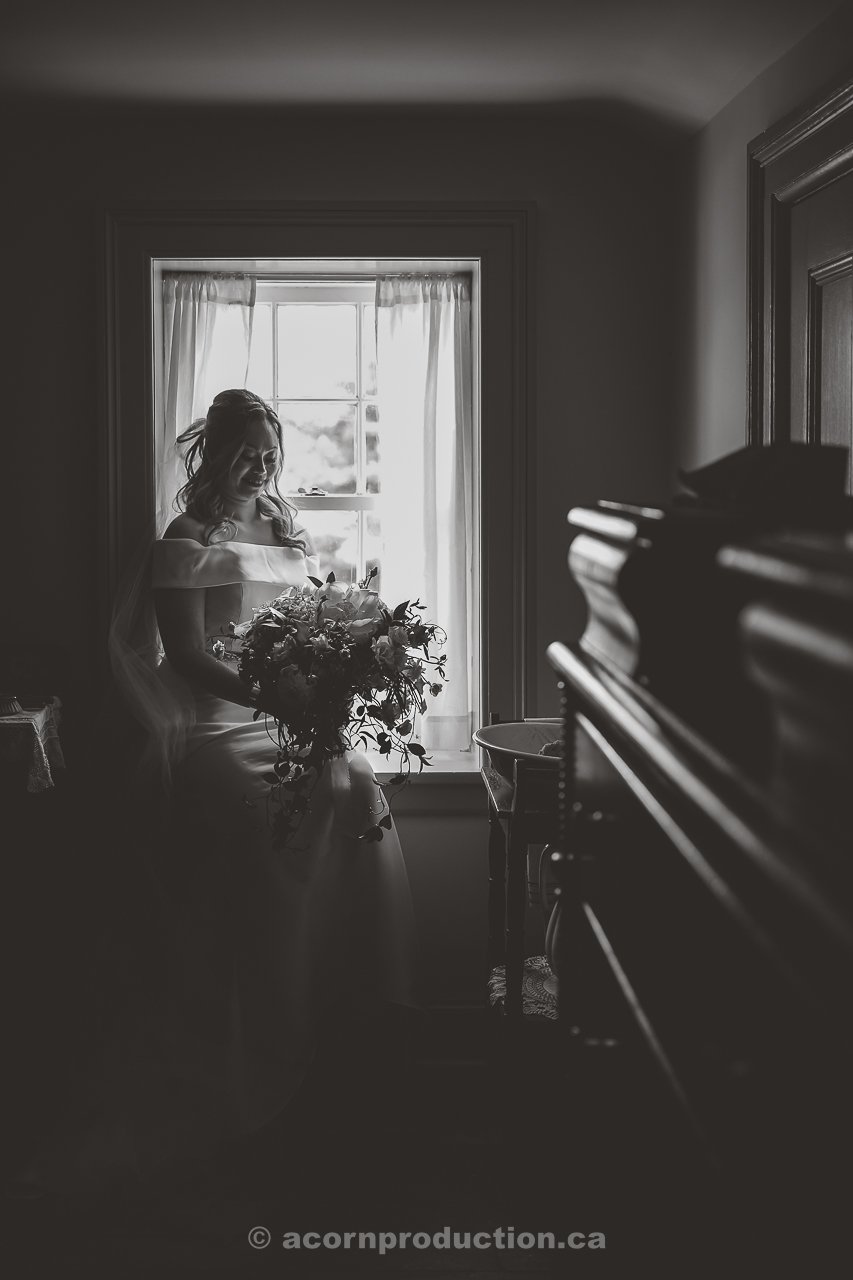 119-bride-sitting-by-the-window-dramatic-bnw-shot.jpg