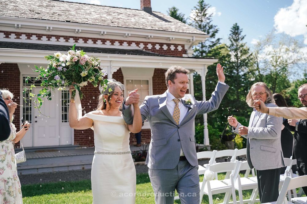 160-happy-bride-and-groom-walking-out-after-ceremony.jpg