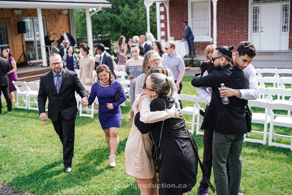 161-wedding-guests-hugging-each-other-after-ceremony.jpg