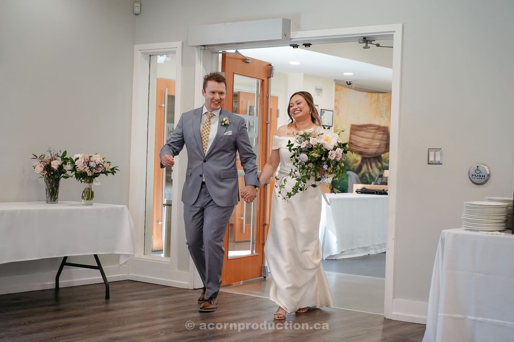 170-bride-and-groom-entering-reception.jpg