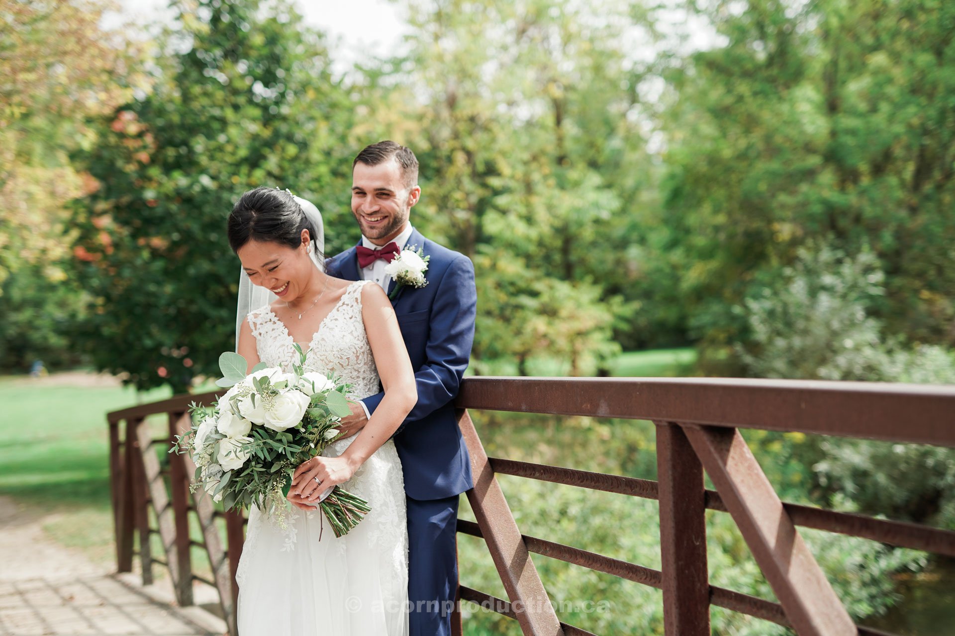 bride-and-groom-catching-a-laugh-during-photo-session.jpg