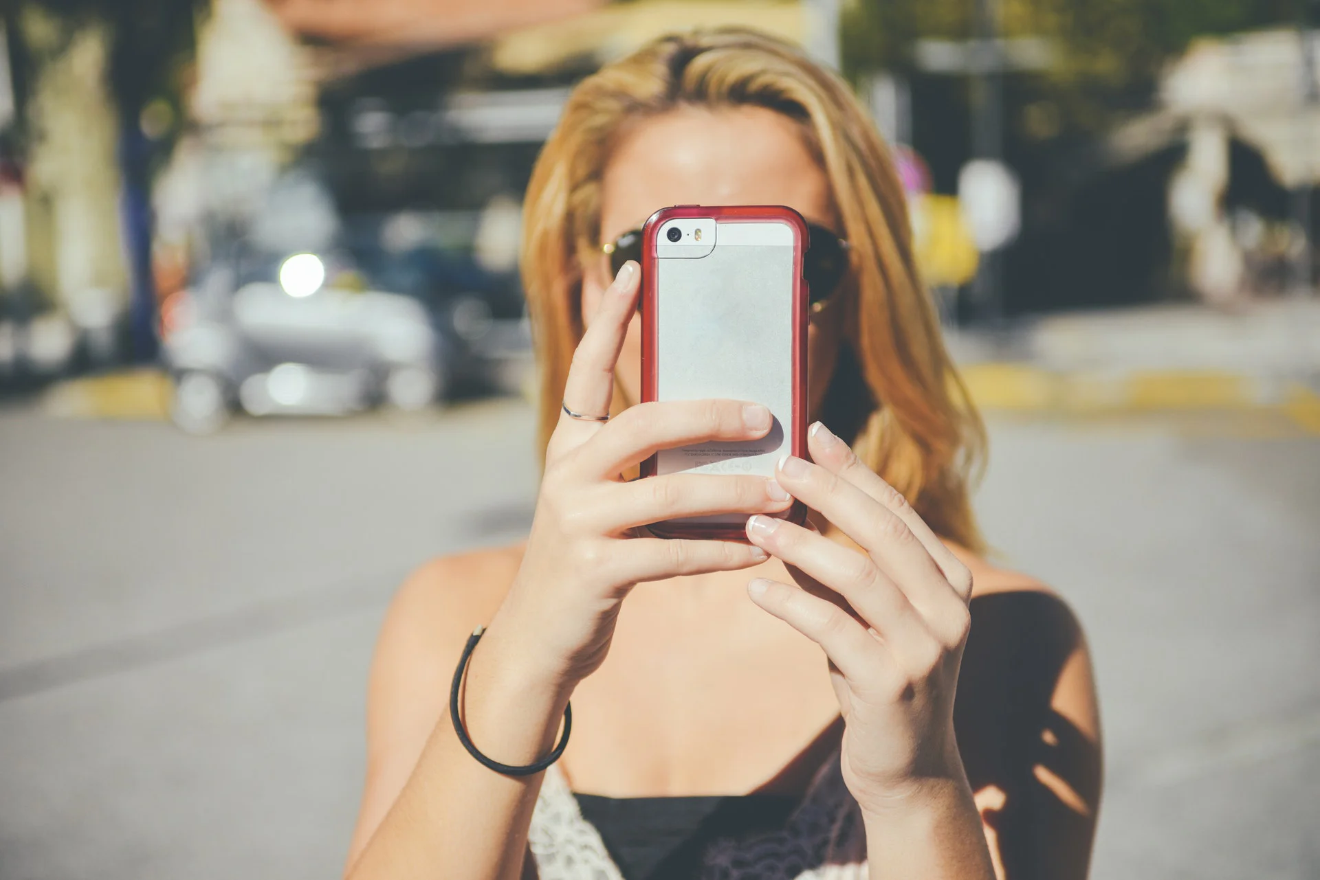 woman filming on phone.jpg