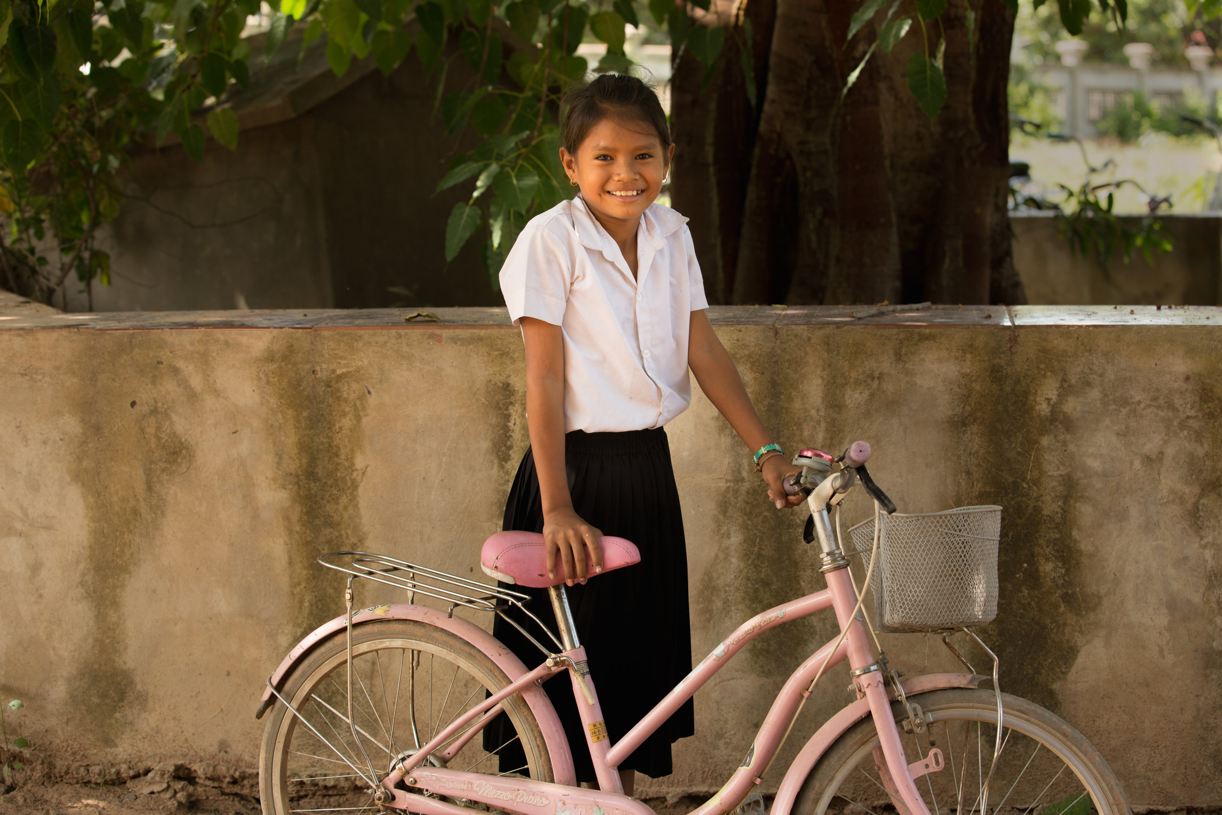 Girls often travel a long distance to school. Many sponsored girls receive a bike from their sponsor 