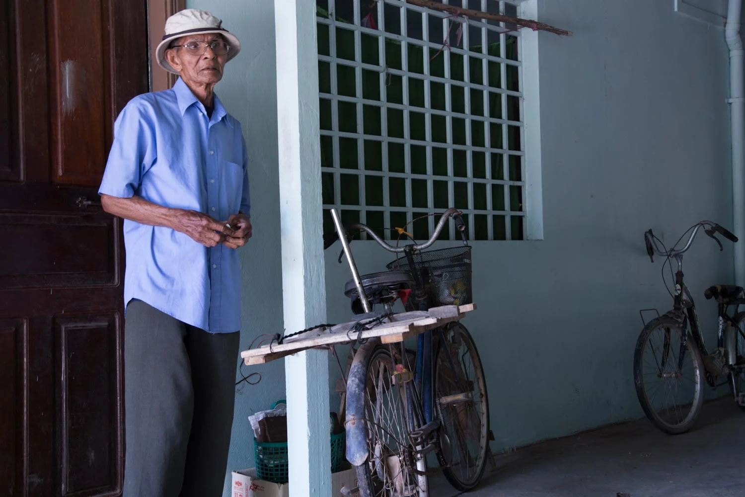 An older gentleman receiving community support - with no social welfare system in Cambodia if you do not have family support you are reliant on organisations such as New Hope for support.
