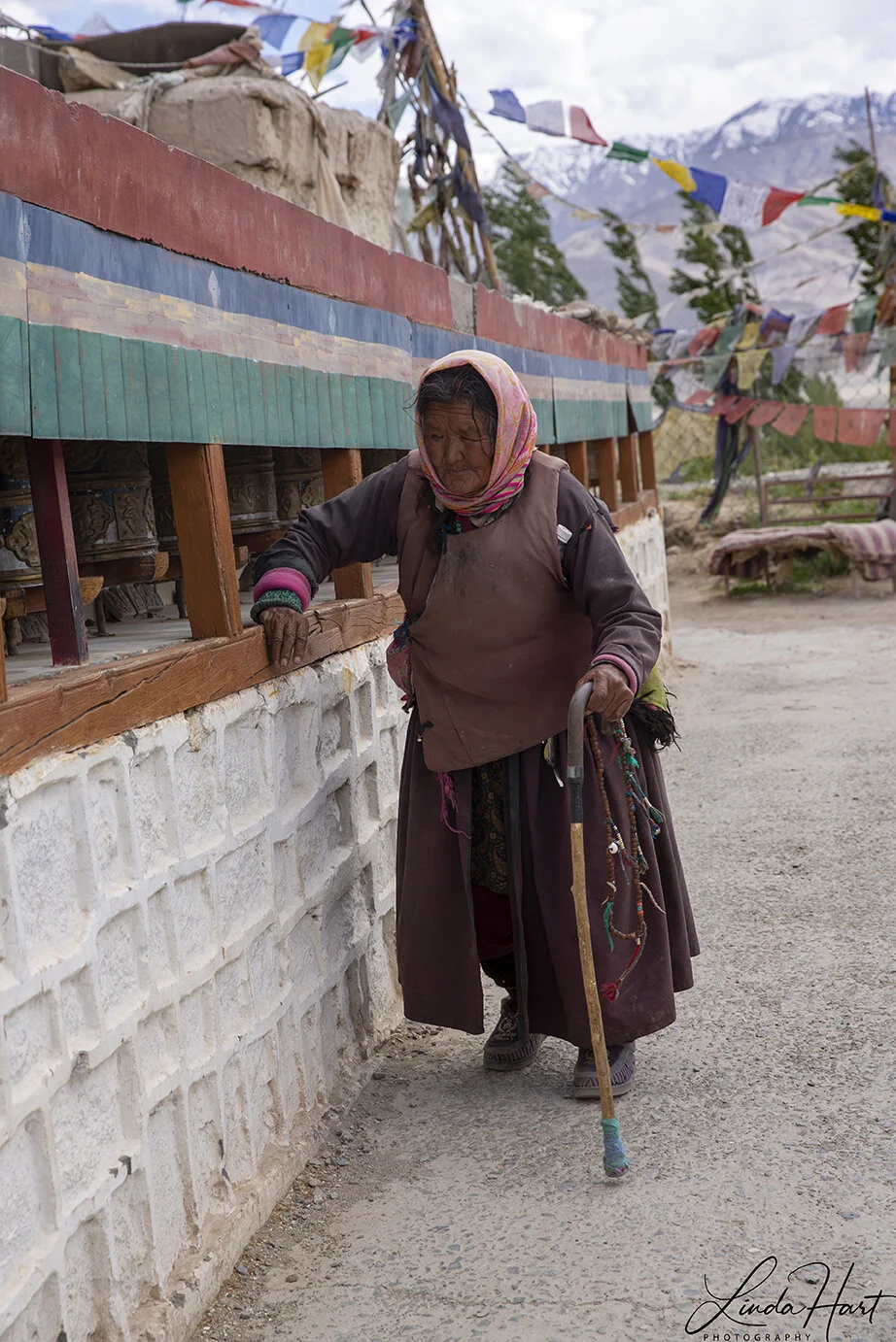 old woman and prayer wheels.jpg