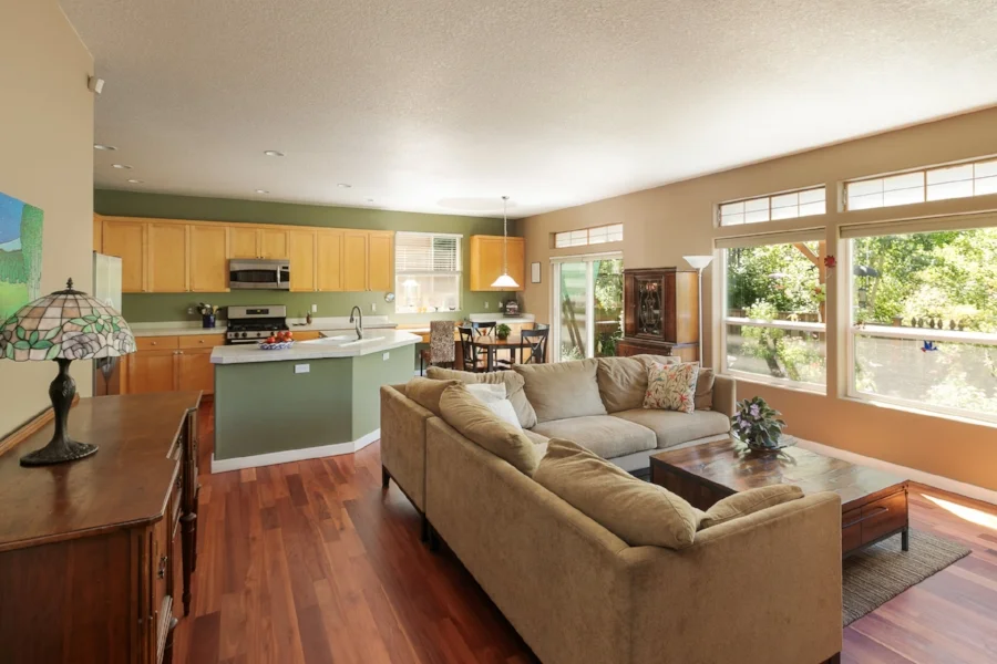 The great room has plentiful natural light from the large windows overlooking the private backyard and nature park. The custom eucalyptus floors warm up the space even more!