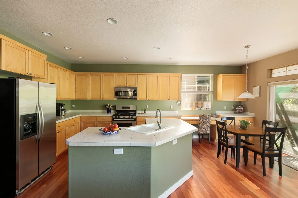 The large, open kitchen, island, and breakfast nook are just what the cook ordered.