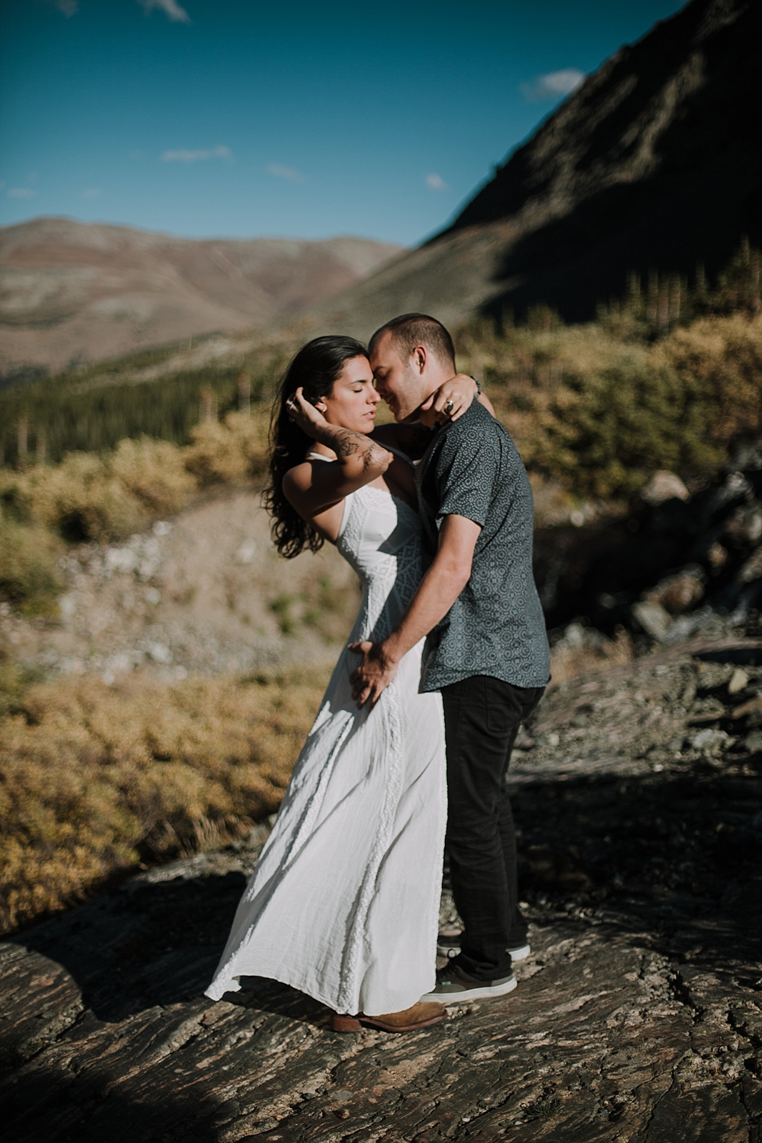 couple posing on a rock, breckenridge colorado wedding photographer, breckenridge colorado elopement photographer, hiking photographer, maui wedding photographer, maui elopement photographer