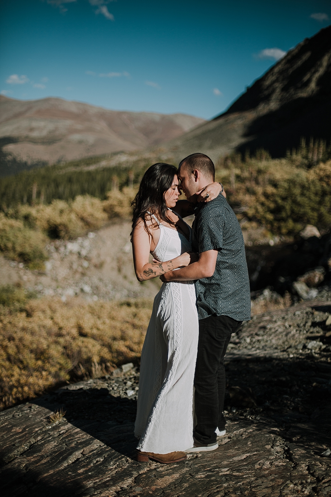 couple posing on a rock, breckenridge colorado wedding photographer, breckenridge colorado elopement photographer, hiking photographer, maui wedding photographer, maui elopement photographer