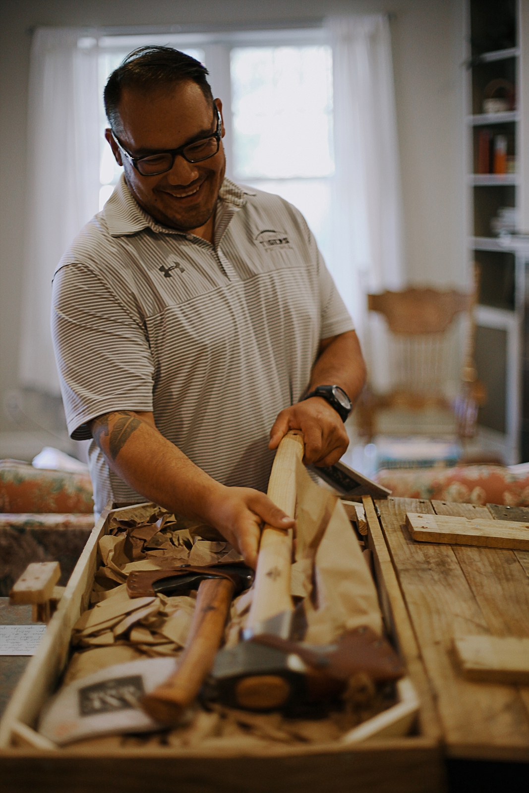 groom opening gift from bride, breckenridge colorado wedding, breckenridge colorado wedding photographer, the church at agape outpost wedding