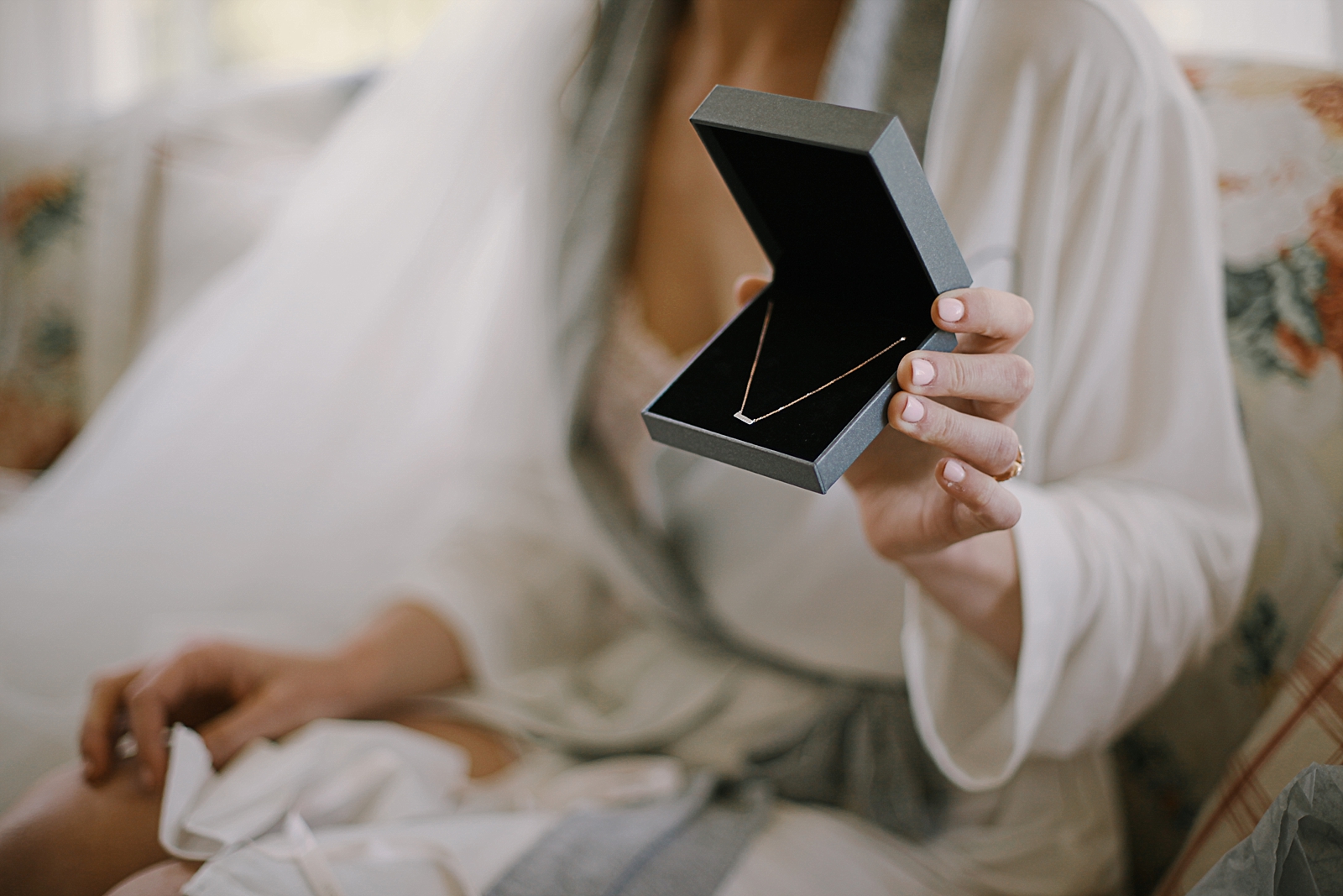 bride opening gift from groom, breckenridge colorado wedding, breckenridge colorado wedding photographer, the church at agape outpost wedding