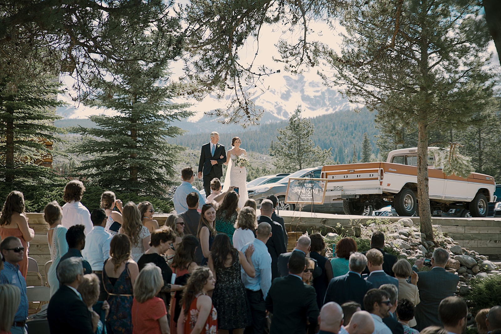 bride walking down the aisle agape outpost, breckenridge colorado wedding, breckenridge colorado wedding photographer, the church at agape outpost wedding, agape outpost wedding photographer