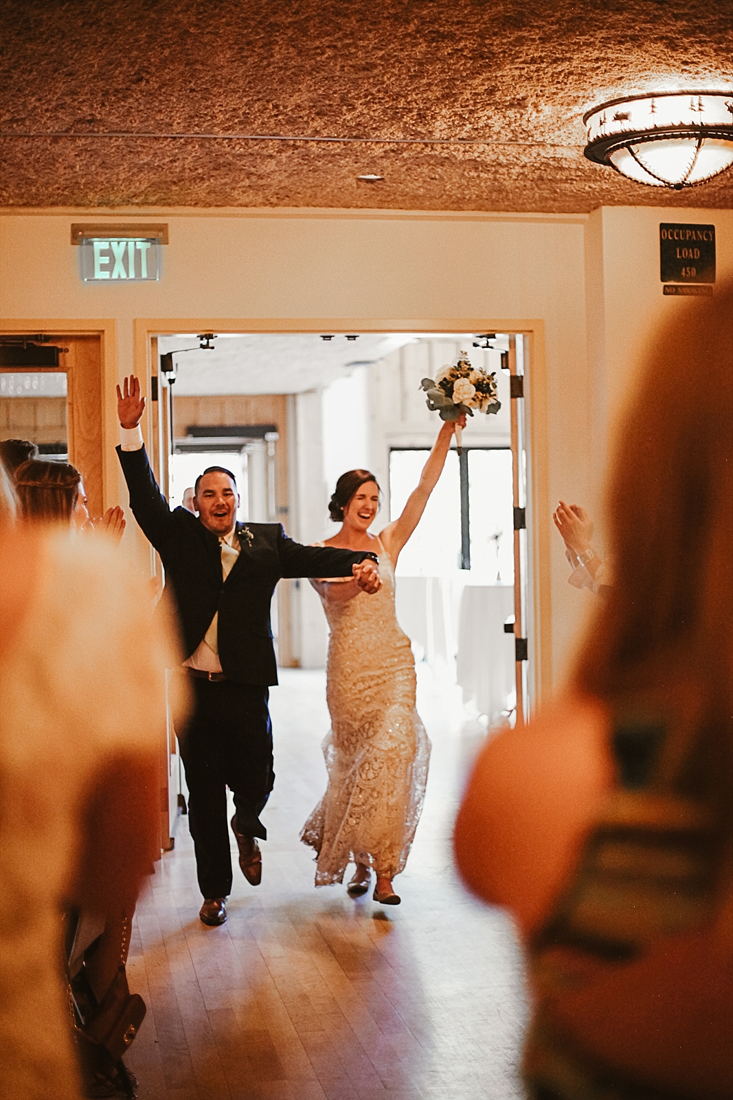 bride and groom entering reception, silverthorne pavillion wedding, silverthorne pavillion wedding photographer, silverthorne colorado wedding photographer