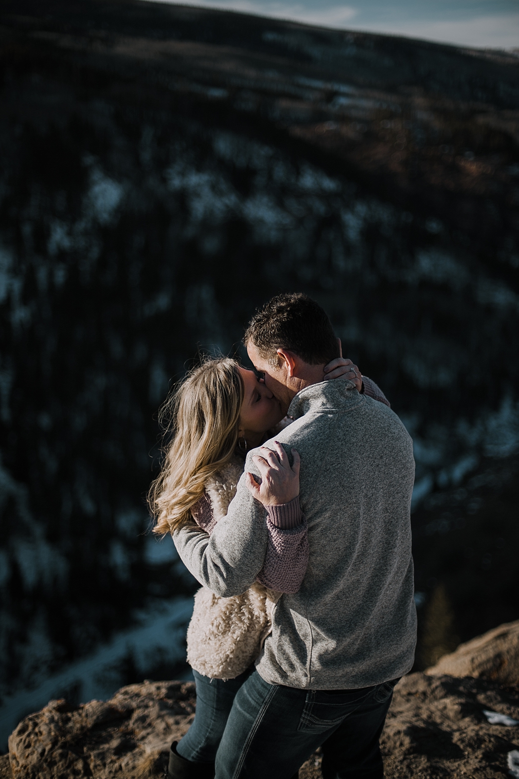 couple on cliffside, adventurous colorado engagements, adventurous colorado wedding photographer, red cliff wedding photographer, leadville wedding photographer