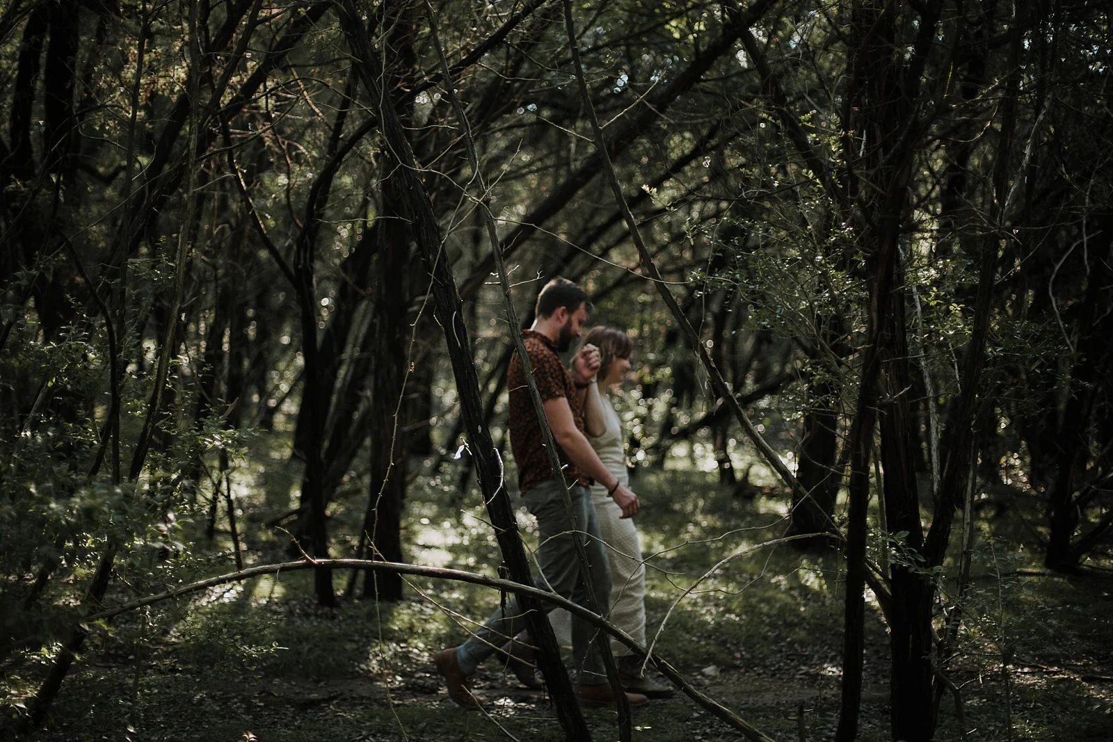 couple hiking through forest, austin texas wedding photographer, intimate paris france wedding photographer, south africa intimate wedding photographer, dripping springs texas wedding photographer