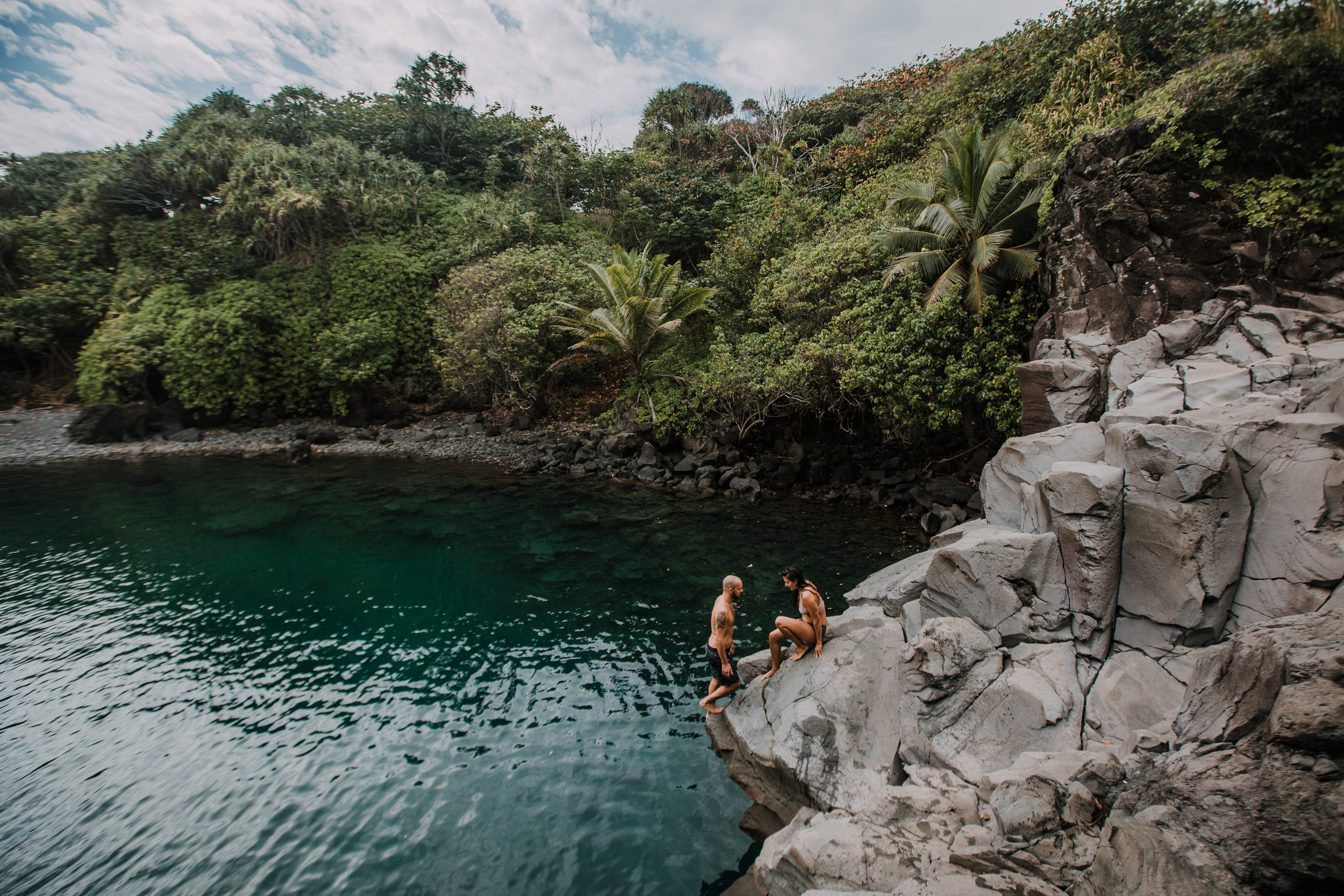 couple on cliff, seven sacred pools at ohe'o, island hiking, road to hana, hawaii wedding photographer, hawaii elopement photographer, maui wedding, maui engagements, maui elopement