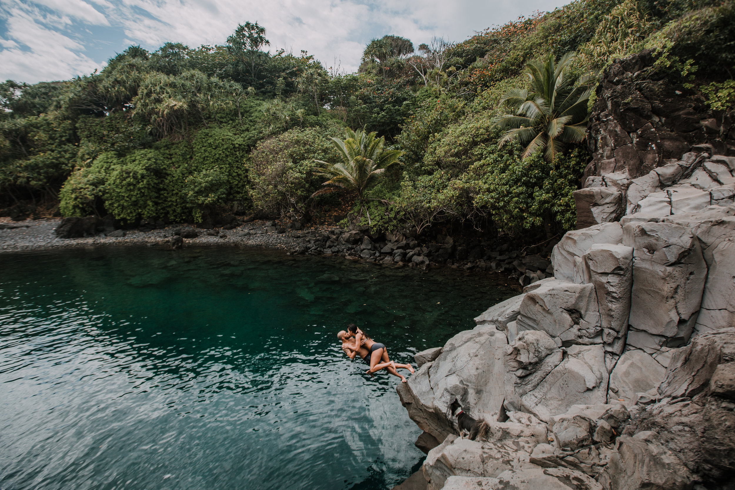 couple jumping off of cliff, seven sacred pools at ohe'o, island hiking, road to hana, hawaii wedding photographer, hawaii elopement photographer, maui wedding, maui engagements, maui elopement